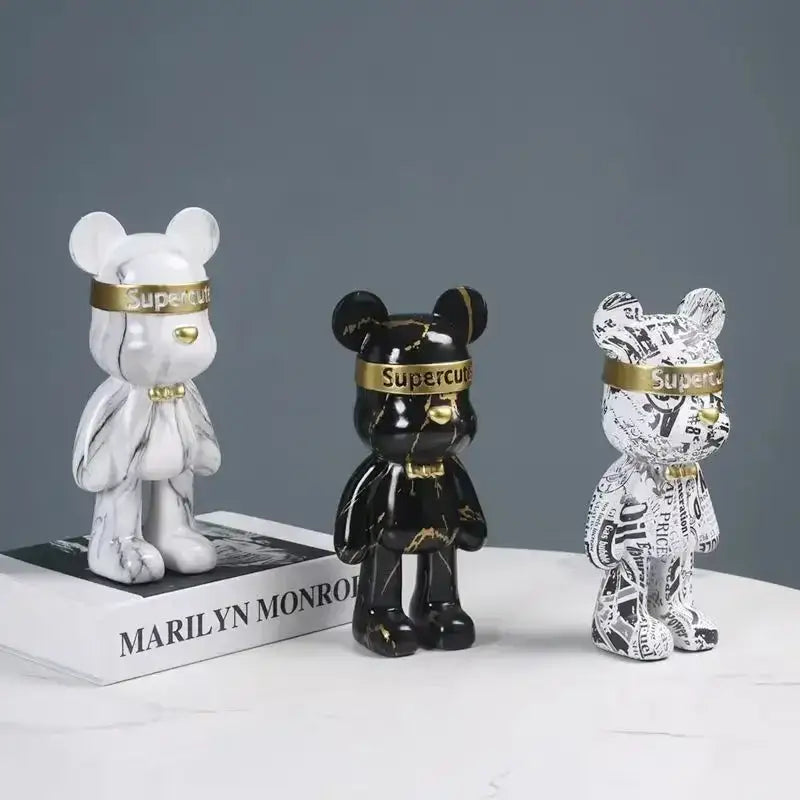 Three glossy modern abstract graffiti bear figurines with gold-trimmed supercube headbands for home decor