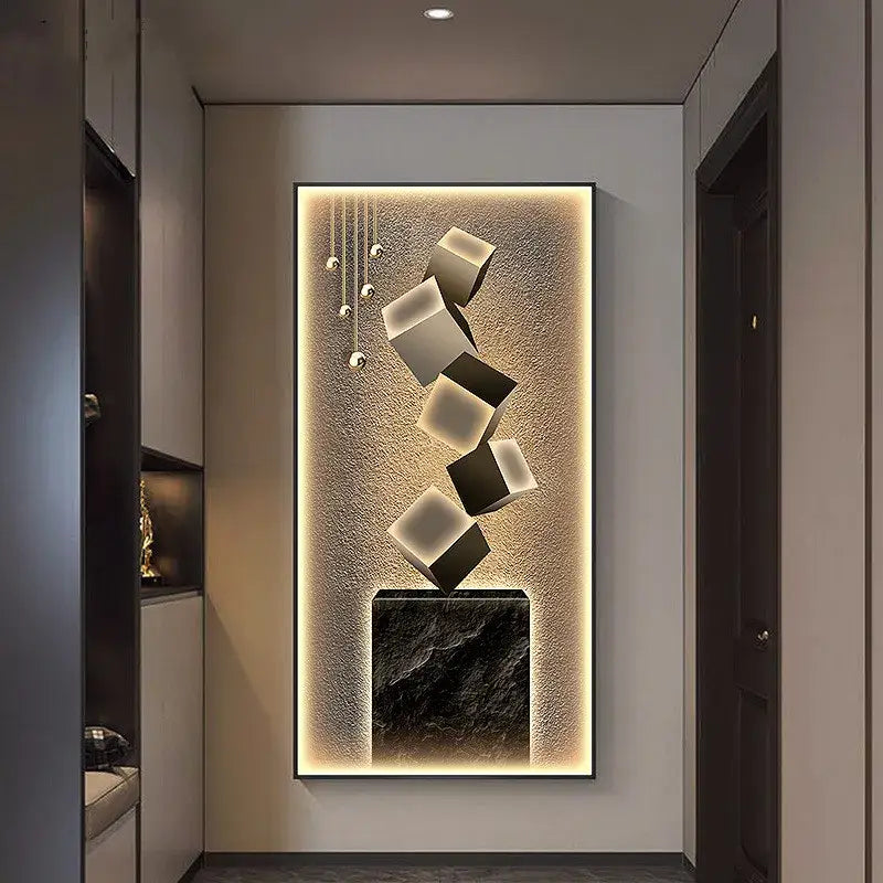Modern abstract metallic led wall lamp featuring floating white and black cubes above a dark marble base with warm backlighting