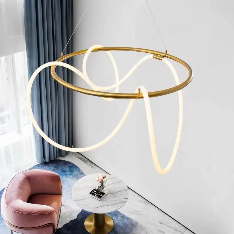 Gold-toned circular pendant light with flowing illuminated led strips forming an abstract design decorbites lines chandelier