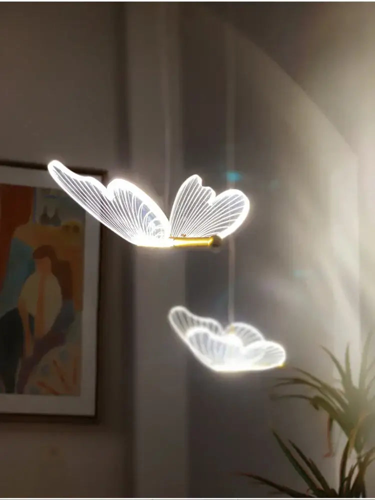Modern acrylic butterfly led chandelier with glowing white butterfly led wings and gold central body for bedroom decorbites butterfly led lighting