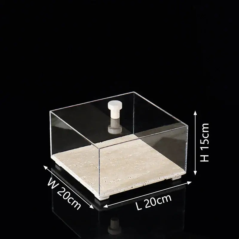 Modern acrylic display case with clear square design, white knob, and textured beige travertine base for dining room