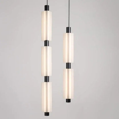 Modern acrylic minimalist pendant lights with frosted glass cylinders and matte black metal accents for bedroom decorbites pendant lights