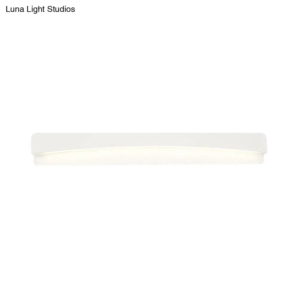 A sleek white acrylic rectangular vanity light fixture with soft diffused illumination for modern bathroom use