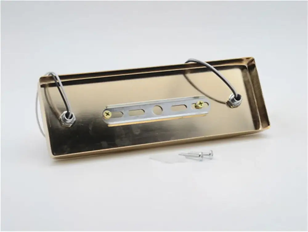 Modern adjustable ceramic ceiling light with brass rectangular fixture, silver bracket, and wire loops for hanging