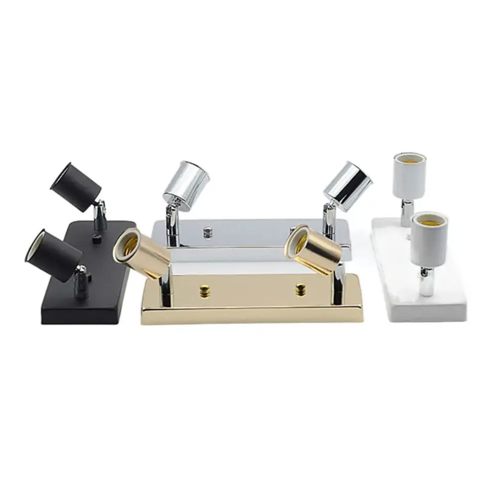 Set of three modern adjustable ceramic ceiling lights in black chrome and gold finishes with matching rectangular bases