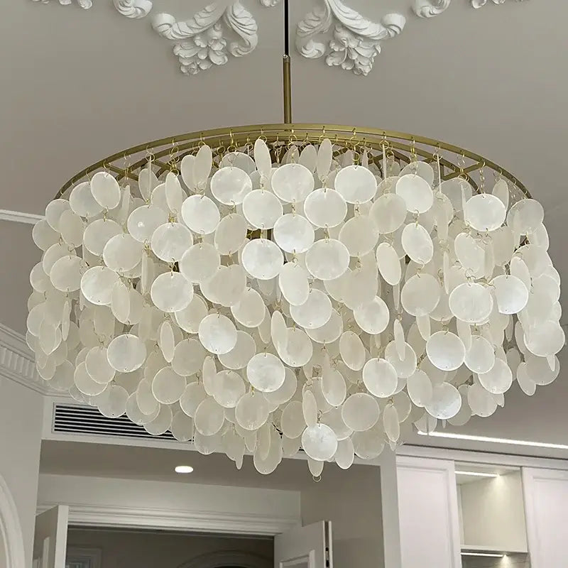 Elegant white aeolian bells shell chandelier with gold-toned circular frame for modern living room decorbites pendant light