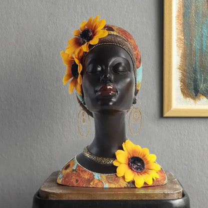 A glossy black resin african beauty figurine with yellow sunflowers and patterned headwrap for decorbites african decor