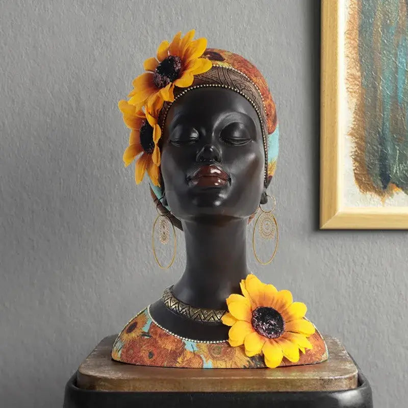 A glossy black resin african beauty figurine with yellow sunflowers and patterned headwrap for decorbites african decor