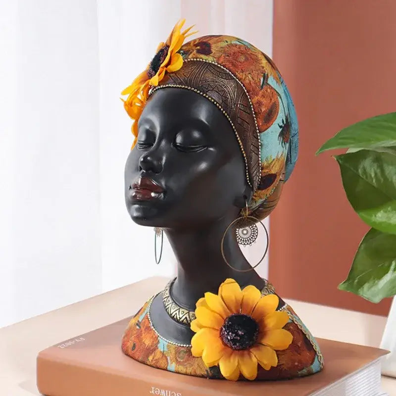 A glossy black resin african beauty figurine with sunflower headscarf and gold-trimmed earrings for decorbites african decor