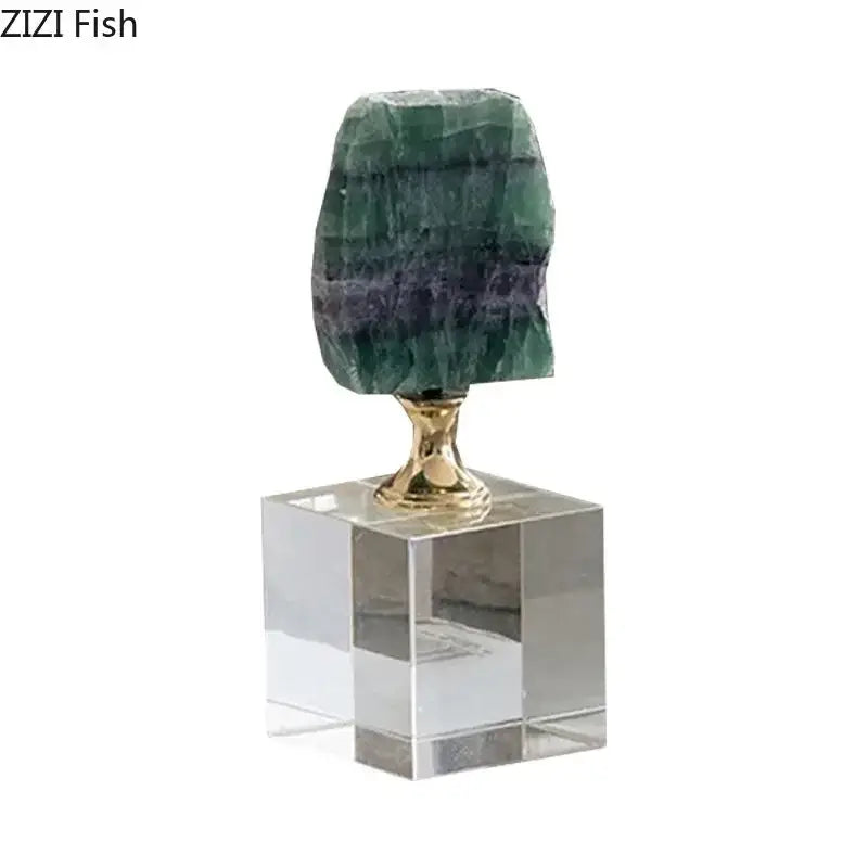A polished green and purple layered agate fluorite geode on a gold-toned decorbites crystal base for living room decor