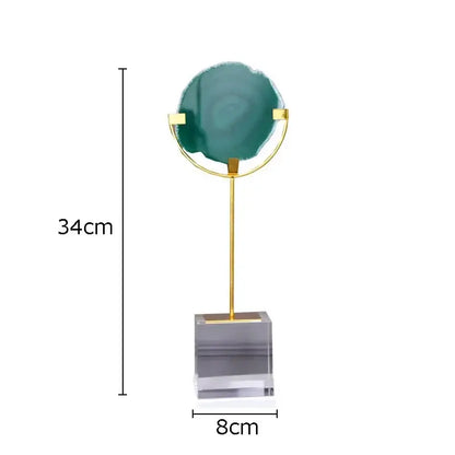 A modern agate fluorite crystal base ornament with teal slice and gold rings on clear acrylic for living room decorbites decor