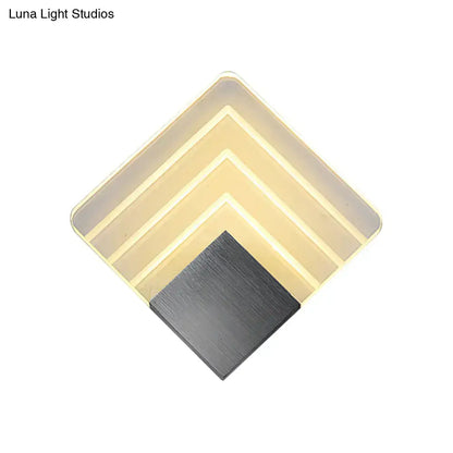 Modern aged silver and black square led wall sconce with layered translucent panels and brushed metal base for bedroom lighting