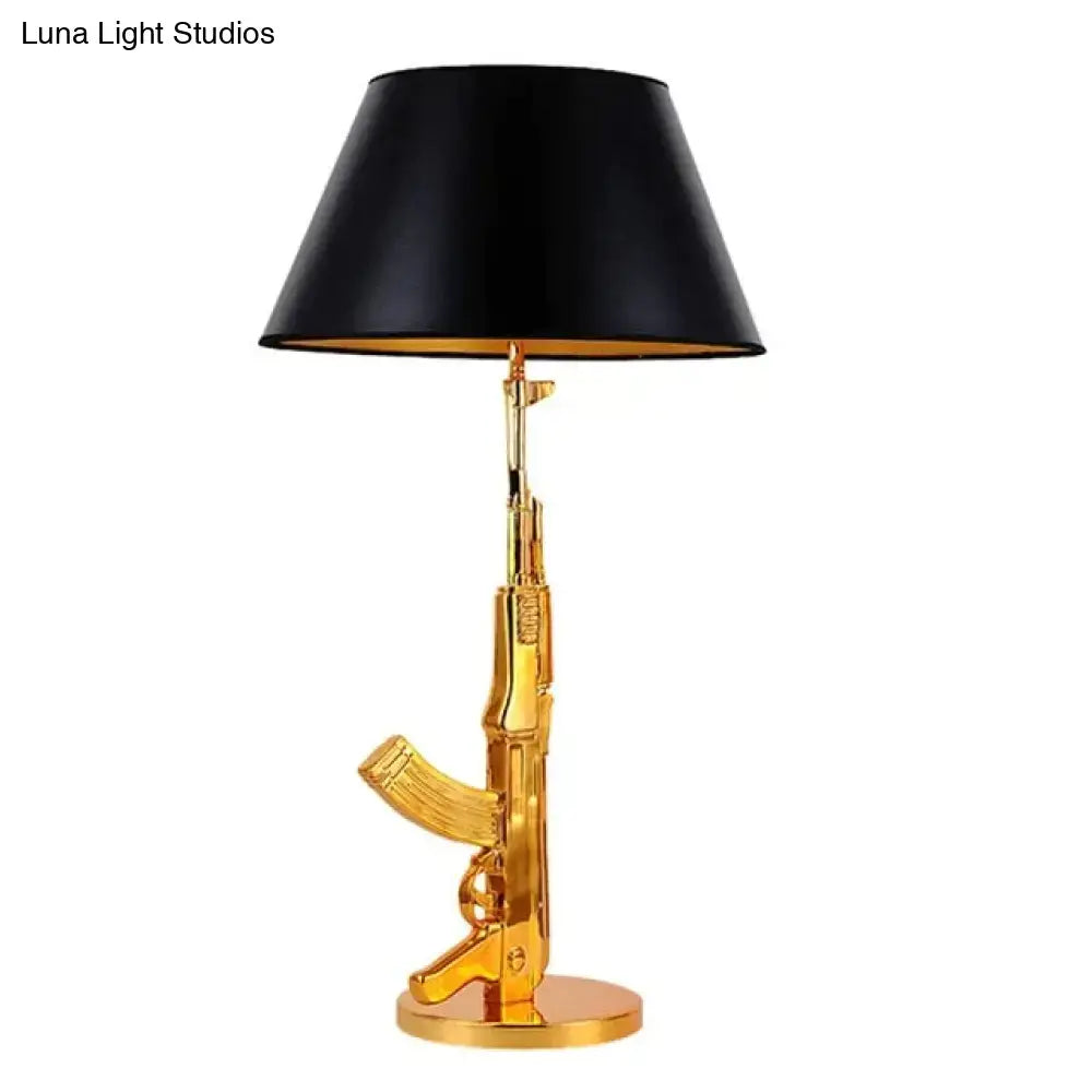 Modern ak47 gun lounge floor lamp with gold ak47 rifle base and black conical shade in silvery gold lustre finish