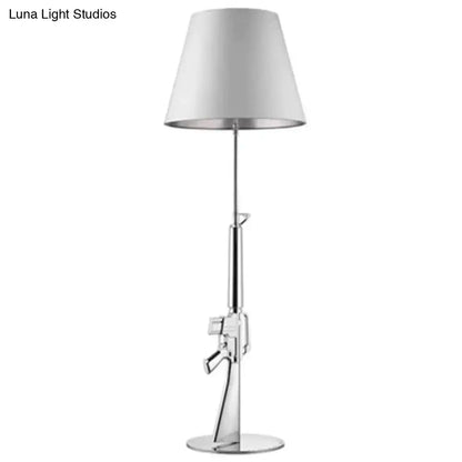 Modern ak47 gun lounge floor lamp with chrome finish, white conical shade, and silvery gold lustre for bedroom lighting