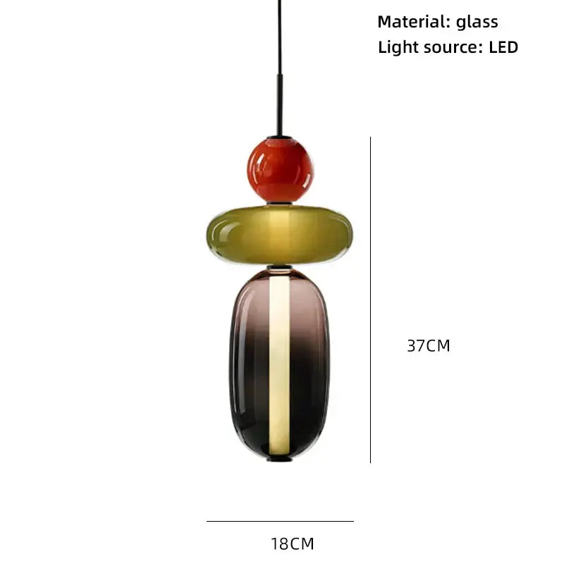 A modern glass pendant light with a glossy red sphere, olive green and dark gradient colorful glass balls for dining room use