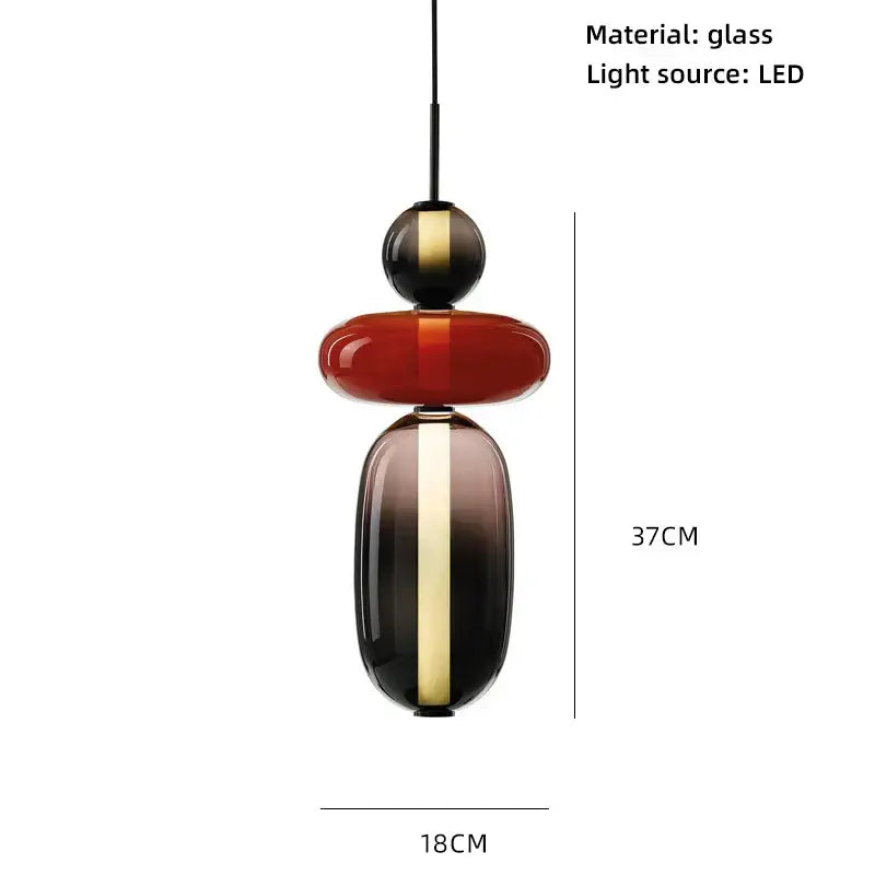 Modern glass pendant lights with colorful glass ball design in bold red and dark gradient accented by gold stripes