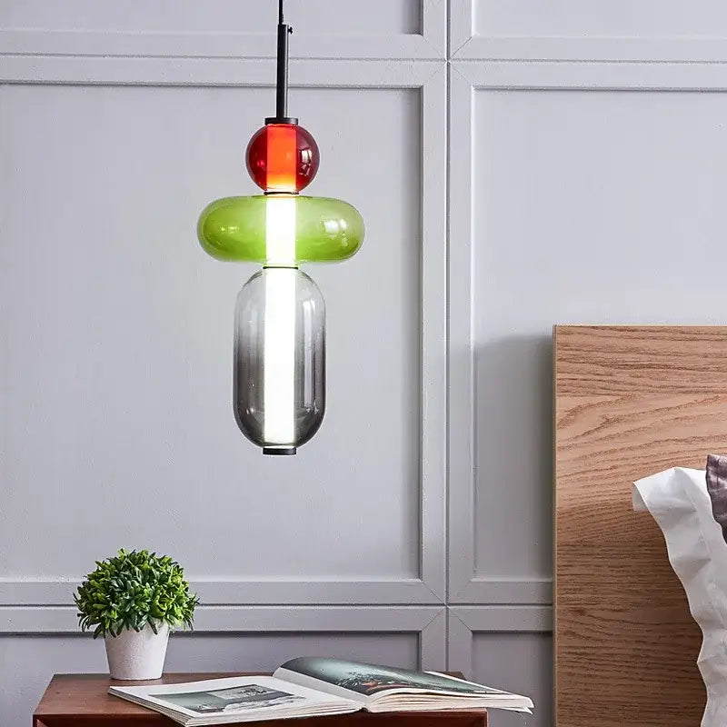 Modern pendant lights featuring stacked colorful glass ball orbs in red green and gradient gray for dining room use