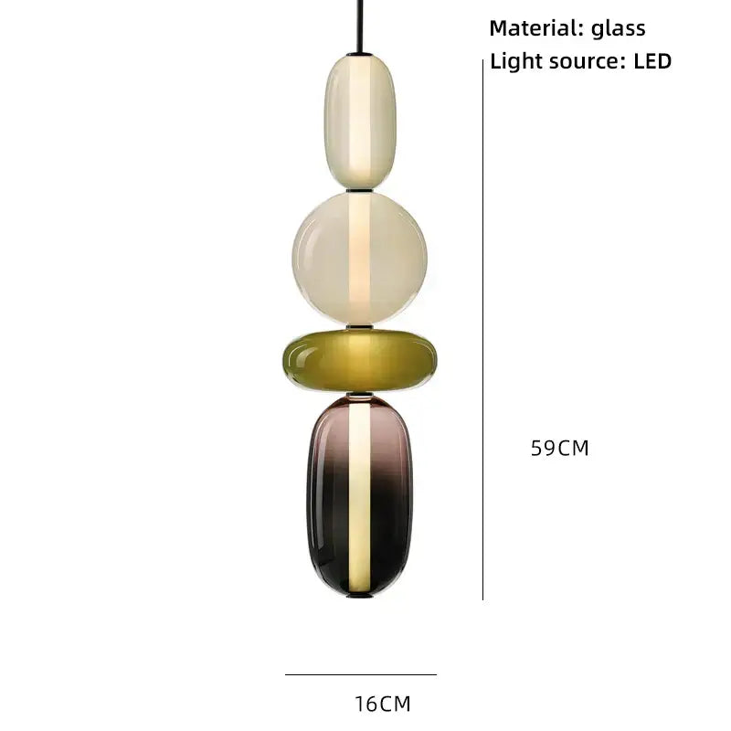 A modern pendant light with four colorful glass ball orbs in cream amber and olive green with central LED glow