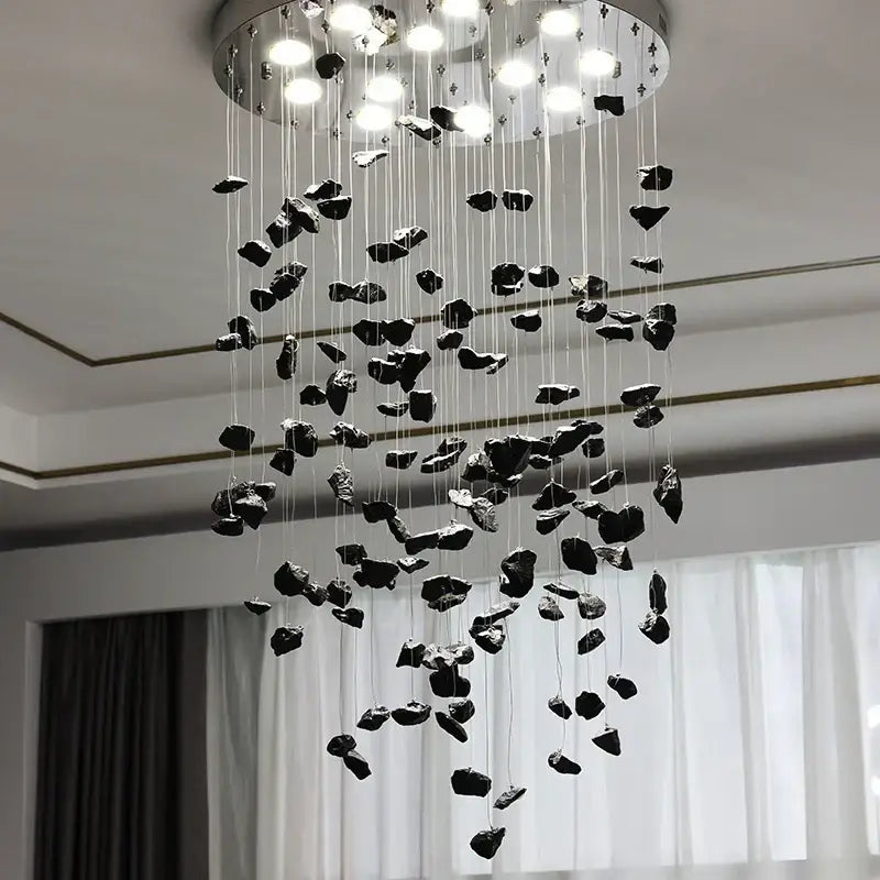 Modern amber and gold colorful crystal stone chandelier with black irregular stone pendant and circular metallic base for dining room decorbites colorful crystal