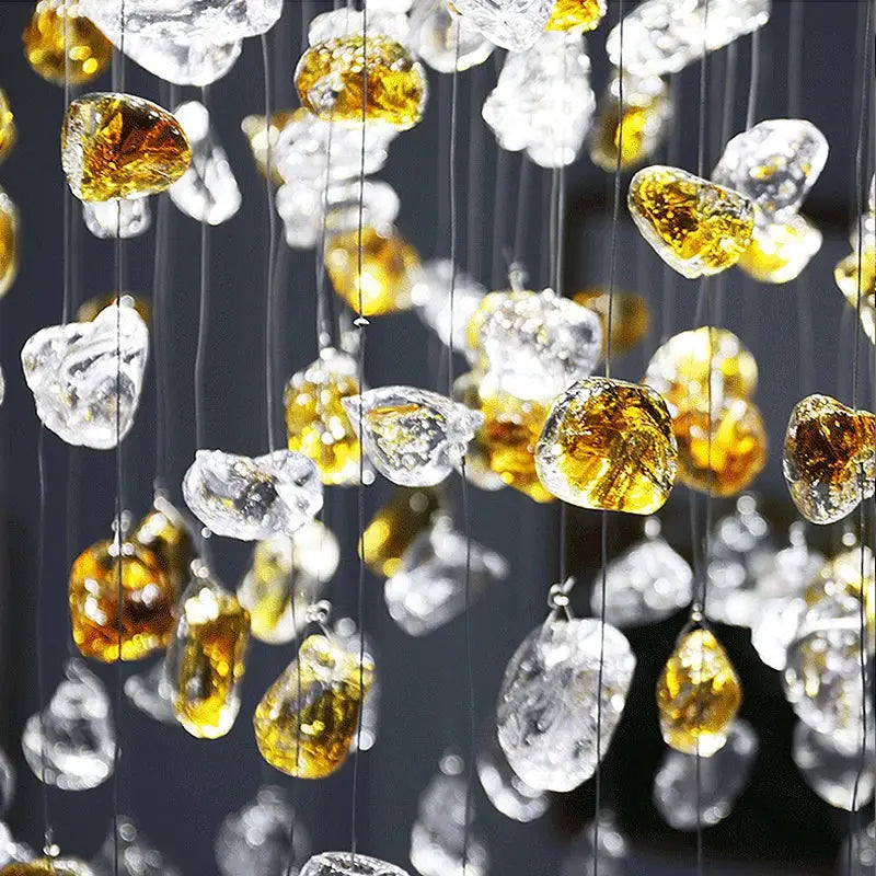 Modern amber and gold crystal stone chandelier with translucent amber and clear glass pendants for dining room decorbites colorful crystal