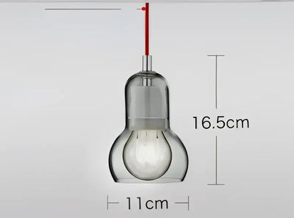 Modern clear glass pendant light with red cord and metallic fixture for dining room glass pendant lights