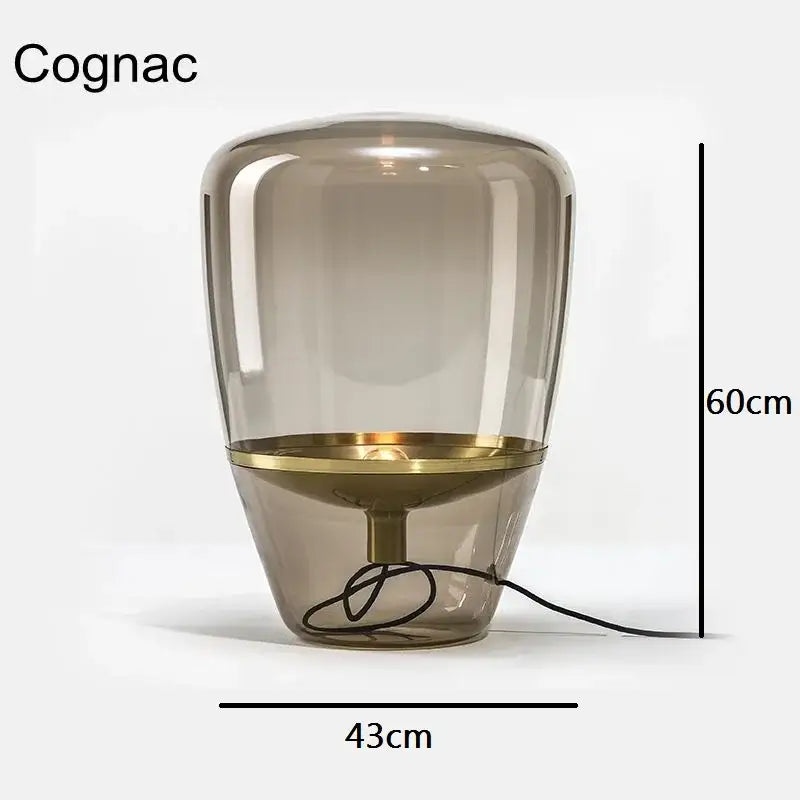 A sleek 60cm cognac-colored balloons led glass table lamp with brass accents for modern home office use