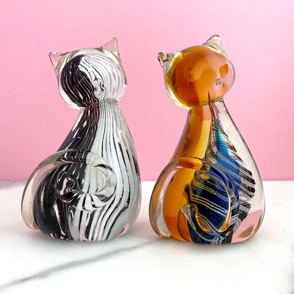 Modern amber and black glass cat figurine set featuring hand-blown swirling patterns for living room decor