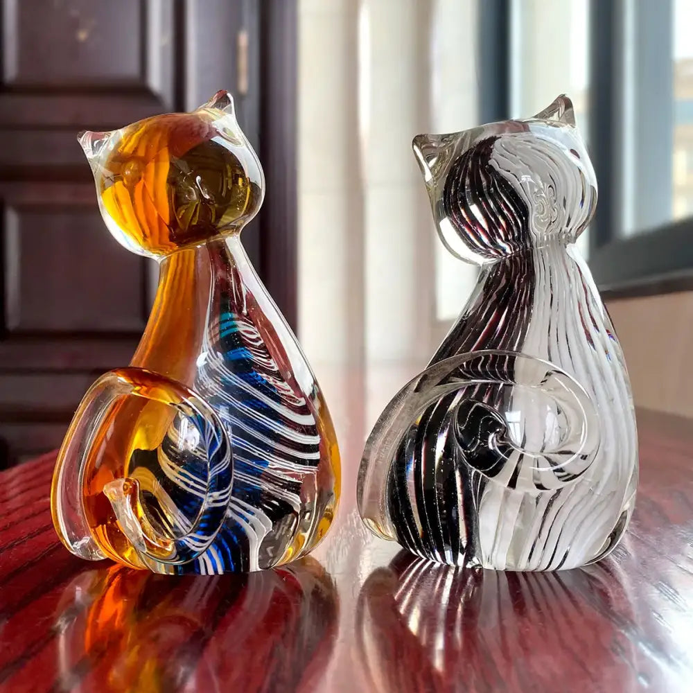 Modern amber and black glass cat figurine set featuring two hand-blown glass cat figurines for living room decor