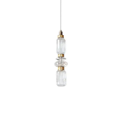 Modern amber and brown glass ballet pendant lamp with clear glass and gold-toned metal accents for dining room use