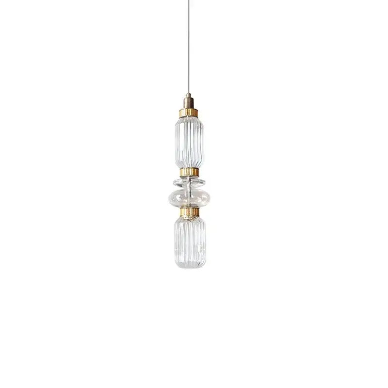 Modern amber and brown glass ballet pendant lamp with clear glass and gold-toned metal accents for dining room use