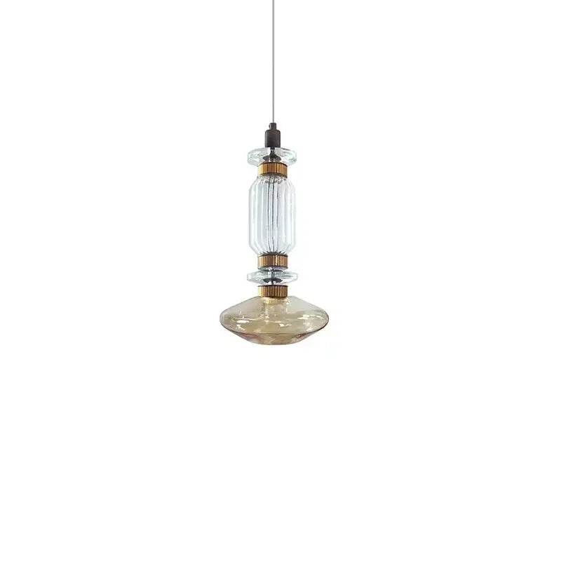 Modern amber and brown glass ballet pendant lamp with clear ribbed glass and brass fittings for dining room lighting