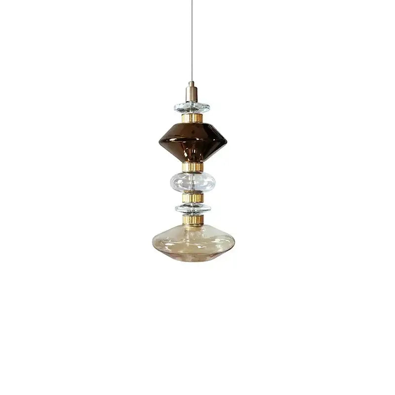 Modern amber and brown glass ballet pendant lamp with stacked orbs and gold rings for dining room lighting