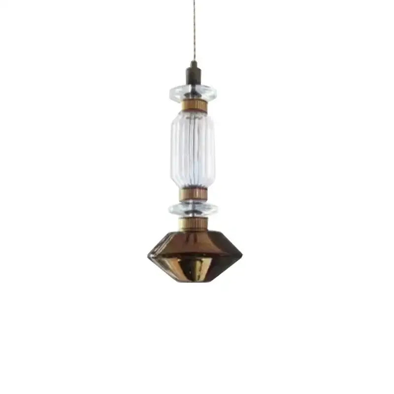 Modern amber and brown glass ballet pendant lamp with clear ribbed glass and brass accents for dining room lighting