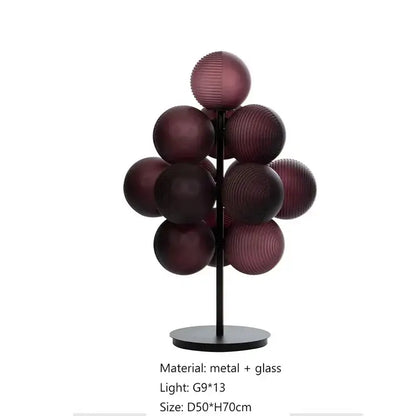 Modern table lamp set featuring deep purple ribbed glass spheres on a sleek black metal stand for living room use