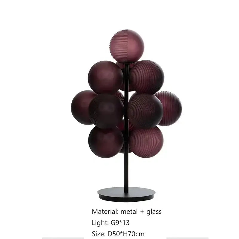 Modern table lamp set featuring deep purple ribbed glass spheres on a sleek black metal stand for living room use
