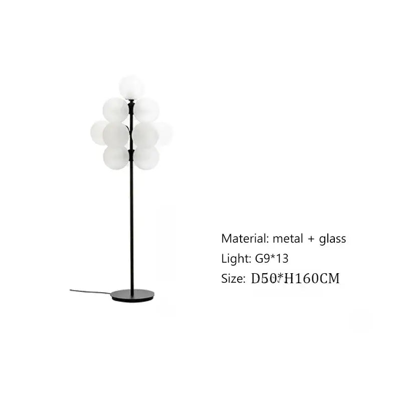Modern amber bubble glass lamp set featuring a black metal floor lamp with frosted globe shades for living room use