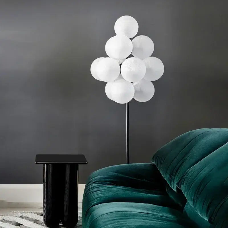 Modern amber bubble glass lamp set featuring a white paper lantern cluster floor lamp with a slender black pole