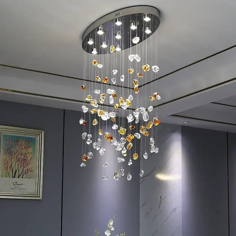 Modern amber and clear crystal dining chandelier with circular metallic base featuring decorbites crystal dining pendants