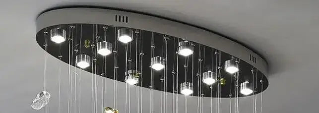 Modern amber and clear crystal dining chandelier with bright LED bulbs suspended by glass chains by decorbites crystal dining