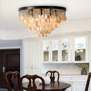 Modern amber and clear crystal led ceiling lamp with black frame and cascading shell pendants for living room decorbites crystal led