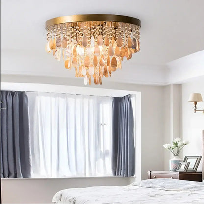 Modern amber and clear crystal led ceiling lamp with brass frame and teardrop pendants for living room decorbites crystal led