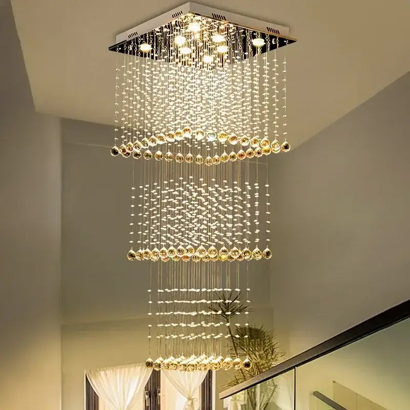 Modern amber and clear decorbites crystal teardrop stairwell chandelier with cascading beads and metallic frame