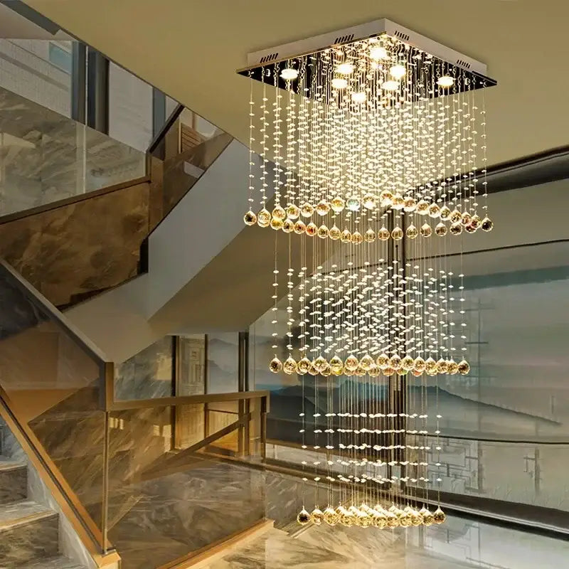 Modern amber and clear crystal teardrop stairwell chandelier with cascading tiers of decorbites crystal teardrop beads