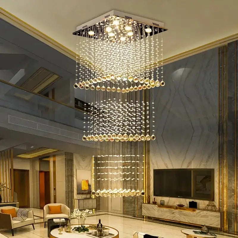Modern amber and clear decorbites crystal teardrop stairwell chandelier with cascading tiers from sleek metallic frame