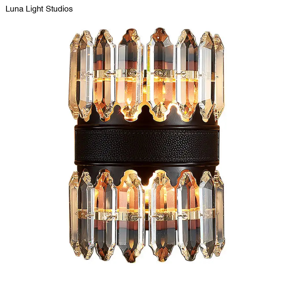 Elegant modern amber and clear crystal wall sconce with two tiers and black textured band for direct wired electric use