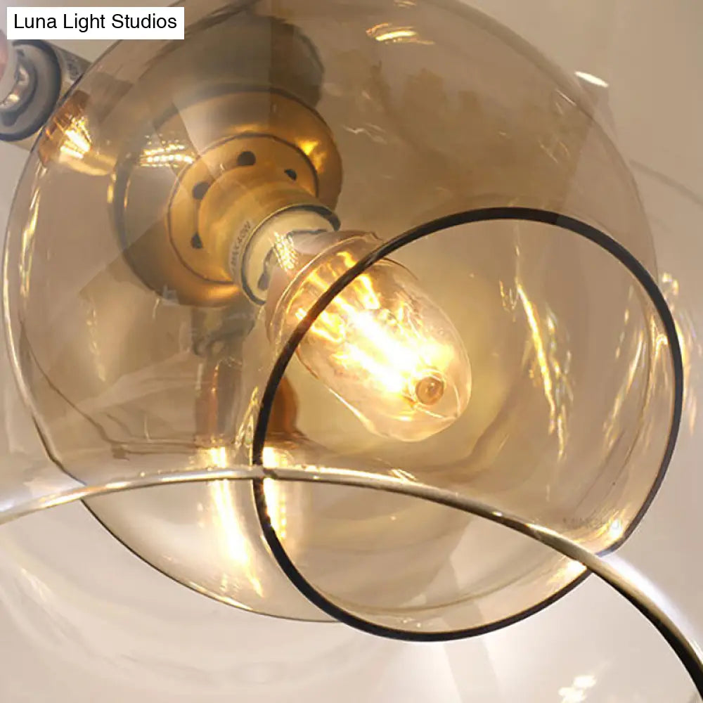 Lámpara de araña moderna de cristal ámbar/transparente para comedor con tres luces.