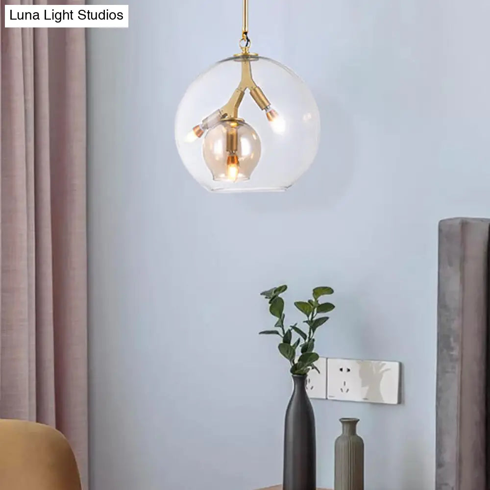 Lámpara de araña moderna de cristal ámbar/transparente para comedor con tres luces.