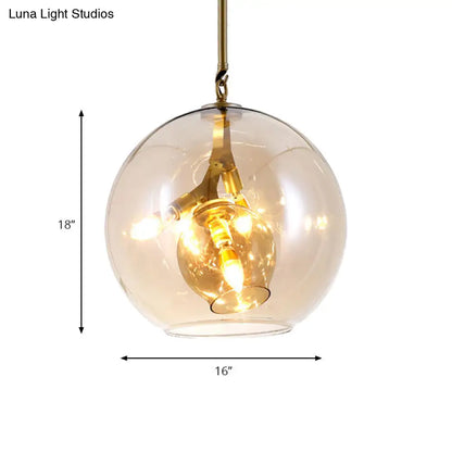 Lámpara de araña moderna de cristal ámbar/transparente para comedor con tres luces.