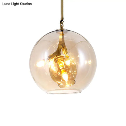 Lámpara de araña moderna de cristal ámbar/transparente para comedor con tres luces.