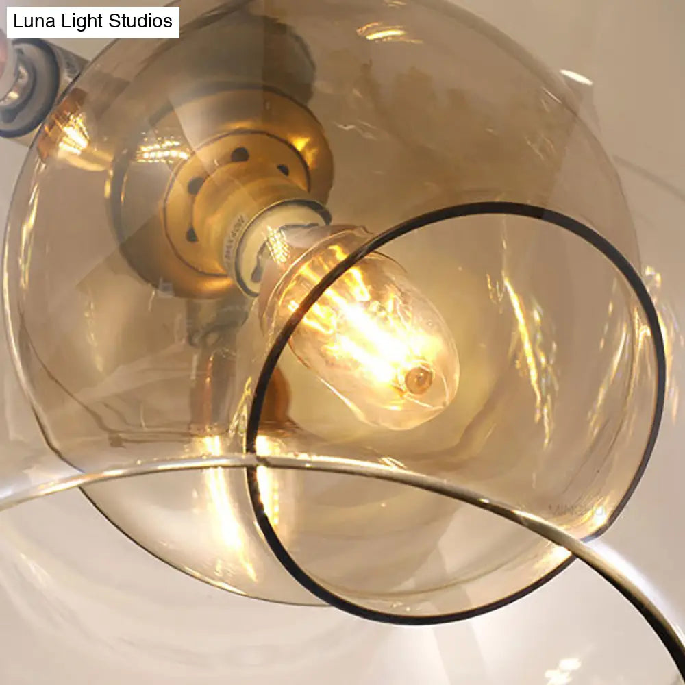 Lámpara de araña moderna de cristal ámbar/transparente para comedor con tres luces.